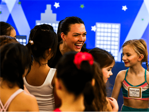 Faculty member with young PeeWee dancers